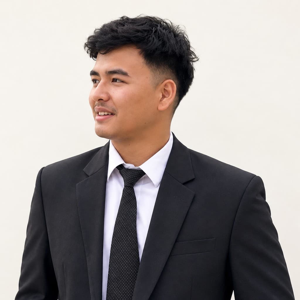 Sanish Shrestha in a black suit and tie